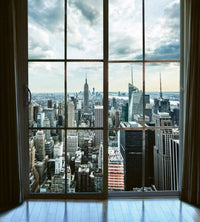 Dimex Manhattan Window View Fotobehang 225x250cm 3 banen | Yourdecoration.be